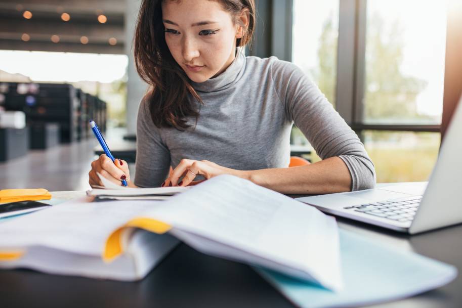 Female student doing homework in Community College